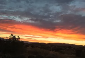 A sunset over a hill.