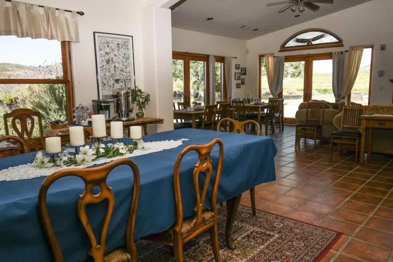 The Great Room and Dining Area featuring blue tablecloth and chairs in dining room.