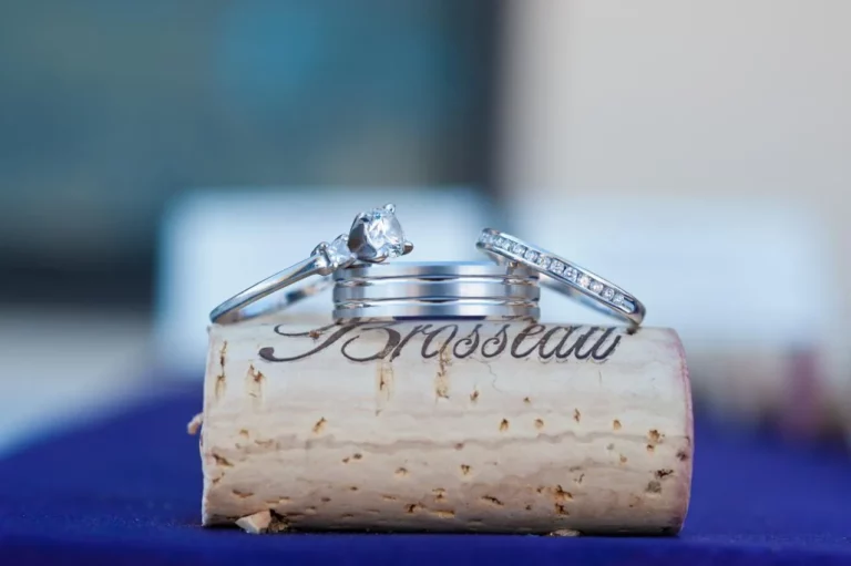 Two wedding rings resting on a cork.