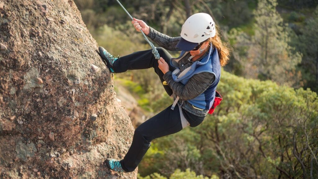 Rock climber scaling a cliff at Pinnacles National Park.